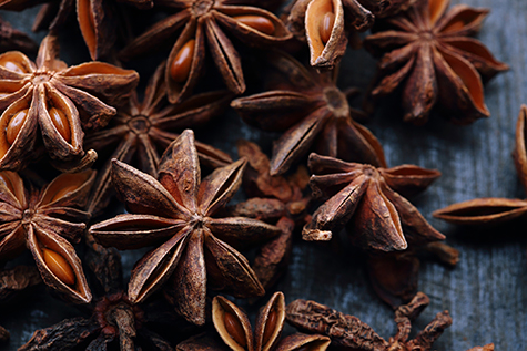 Star anise seeds on the wooden background
