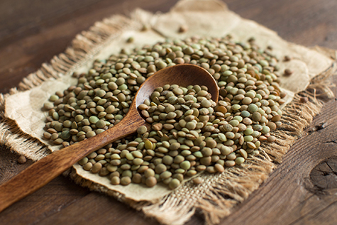 Green lentils with a spoon