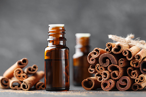 Cinnamon essential oil for spa, aromatherapy and wellness. Medical background.