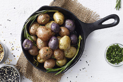 Cooked small potatoes in a skillet