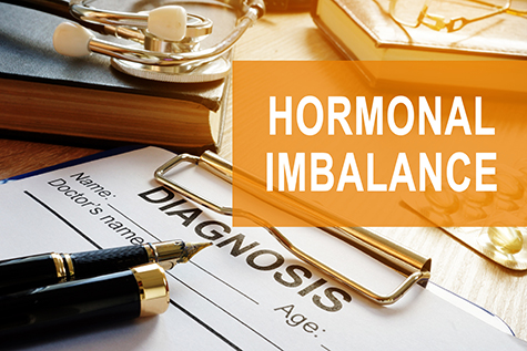 Hormonal imbalance concept. Medical documents on a desk.