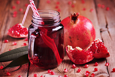 Natural pomegranate juice in a Mason jar