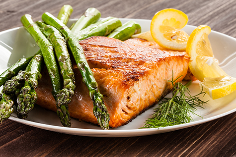 Grilled salmon with French fries and asparagus
