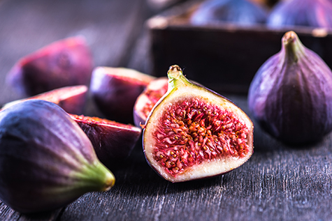 Whole and cut fresh vibrant figs fruit