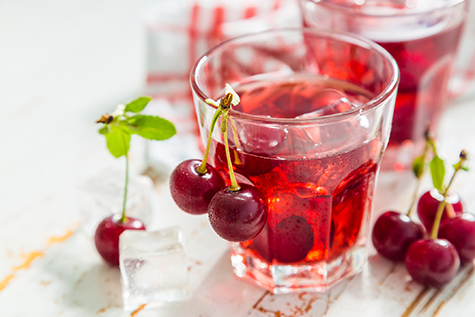 Cold cherry summer drink in glasses