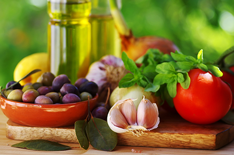 Ingredients for a mediterranean diet on green background close-up